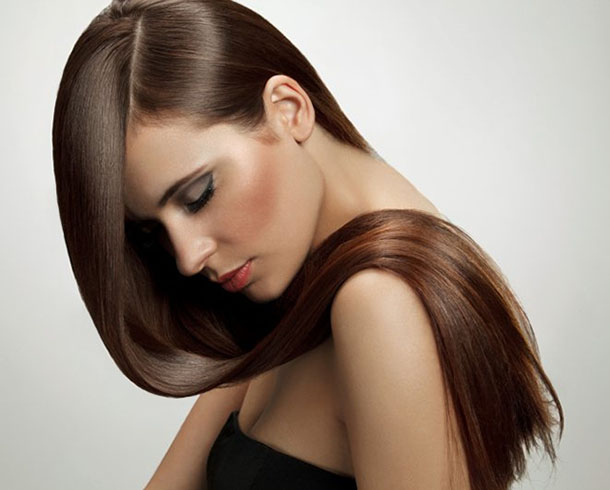 Young woman with silky smooth straight hair