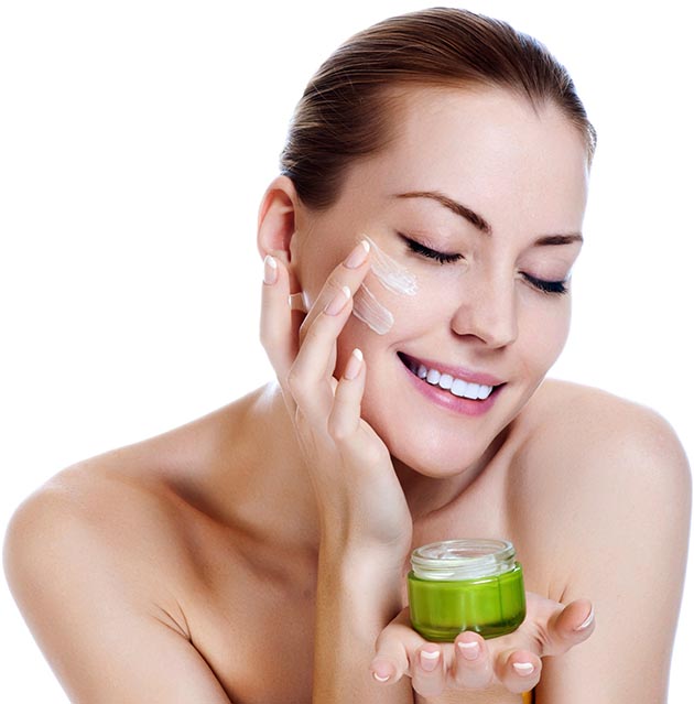 Woman with small jar of moisturizing cream