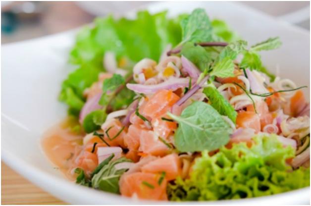 Salmon salad in white bowl