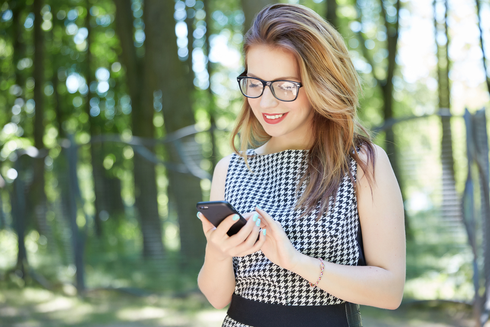 Woman on phone outdoors