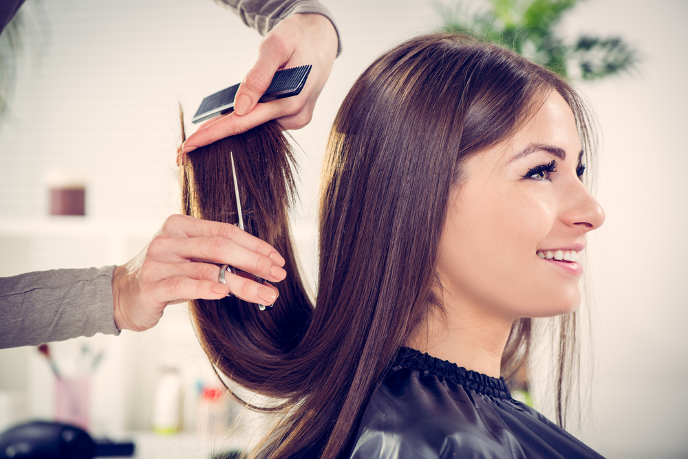 Woman getting her hair cut