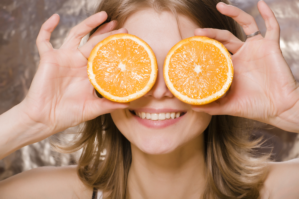 Woman holding orange slices