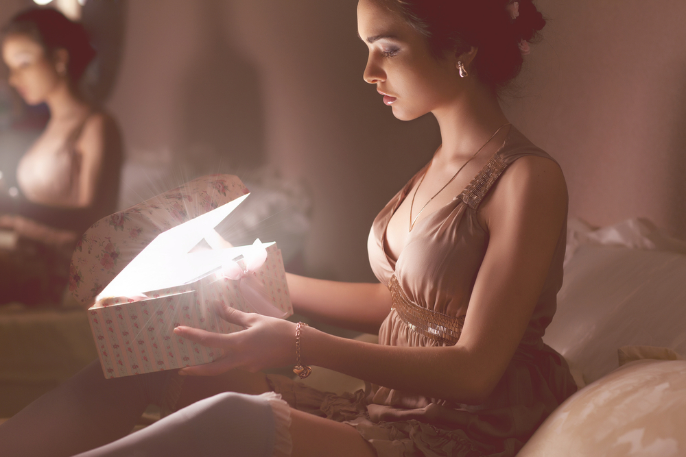 Woman opening a gift box