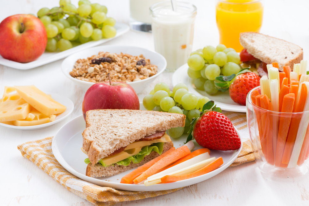 Healthy breakfast with fruit and sandwich