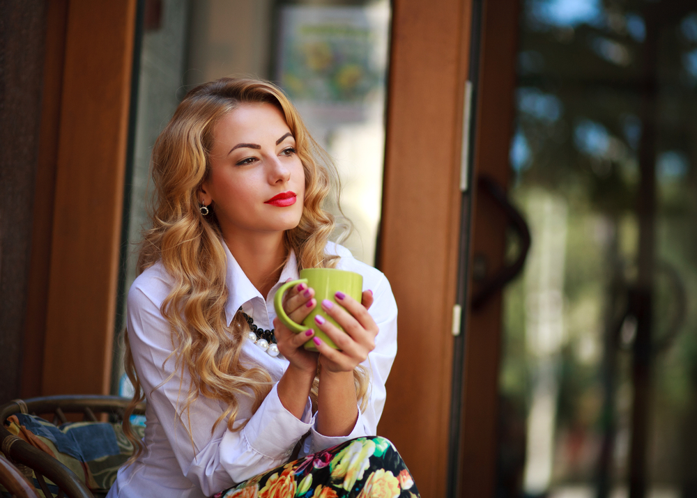 Woman drinking green tea