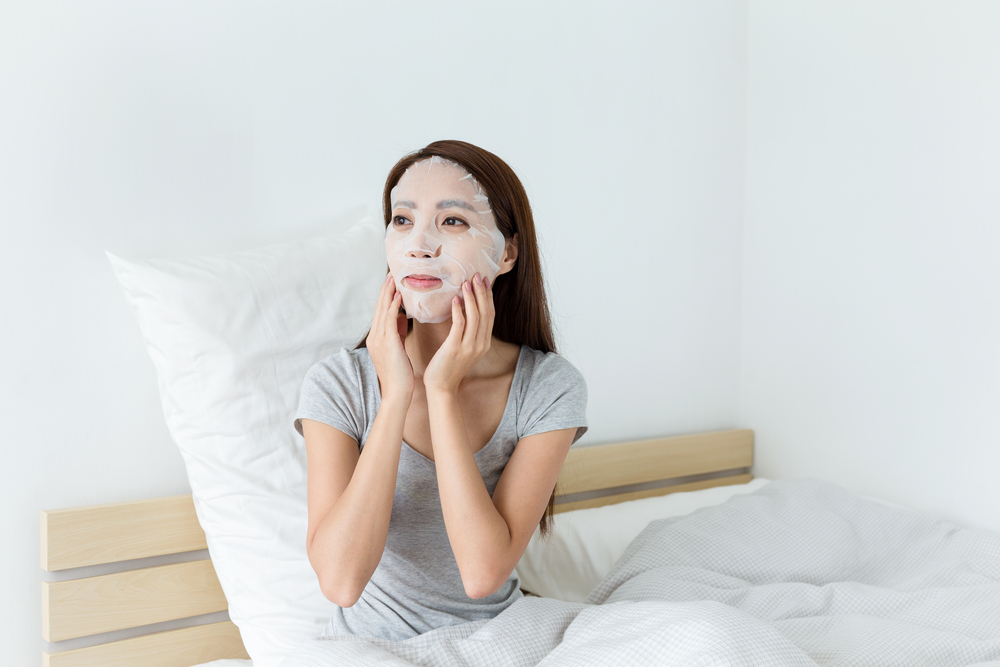 Woman wearing a sheet mask