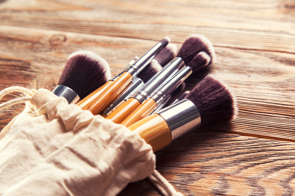 Makeup brushes on wooden table