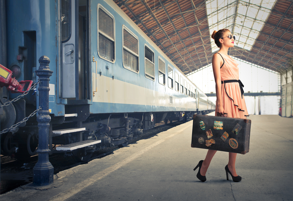 Women traveling with a suitcase.