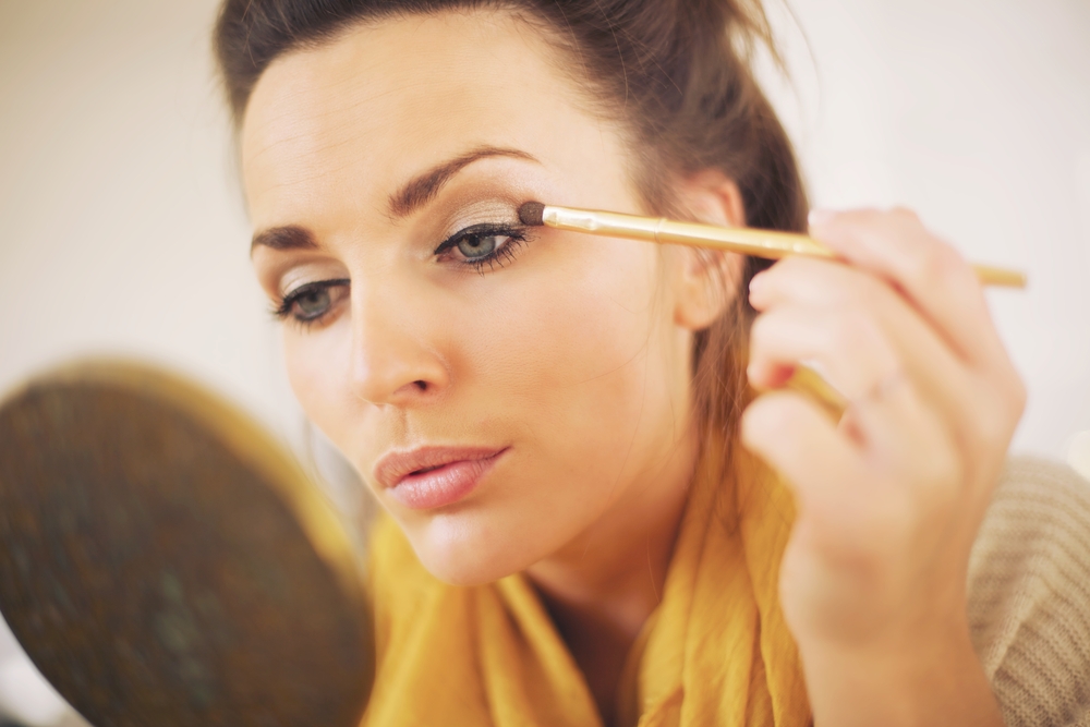 Woman applying eyeshadow