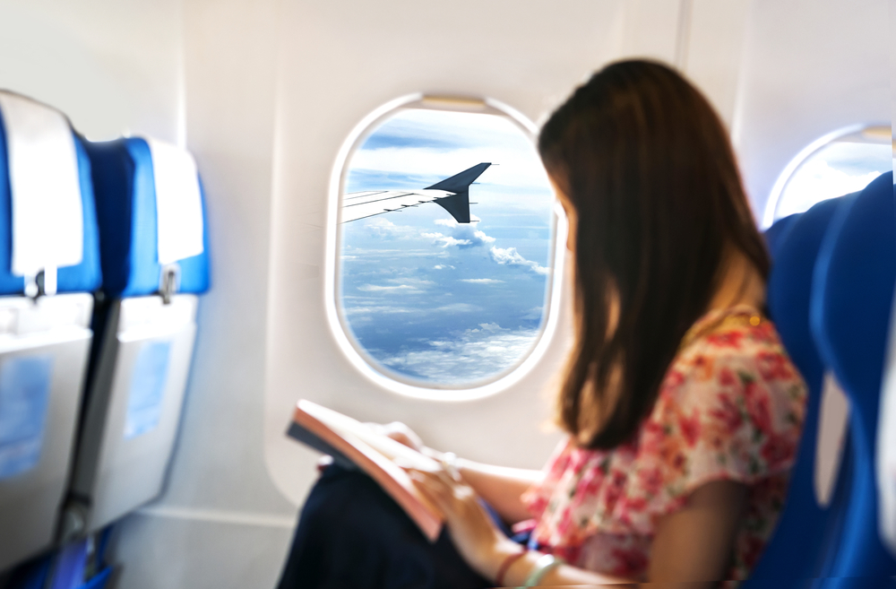 Woman reading on the plane