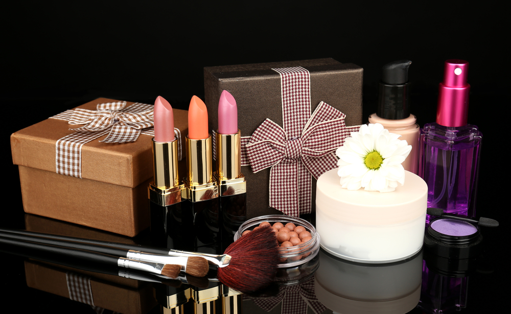 Makeup products on black marble table