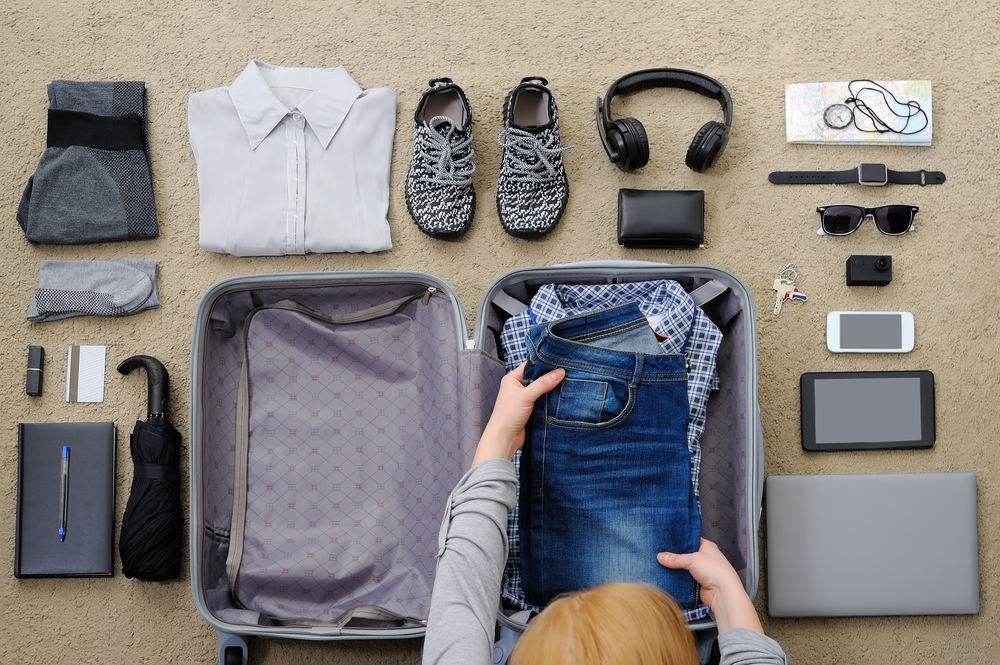 Woman packing suitcase