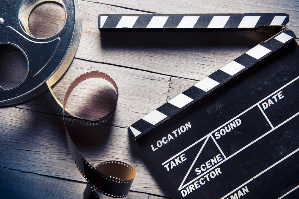 Film reel on wooden table