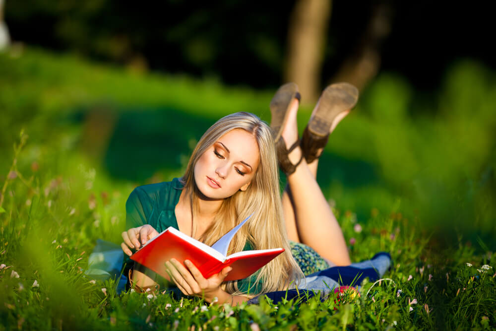 Woman reading in the grass