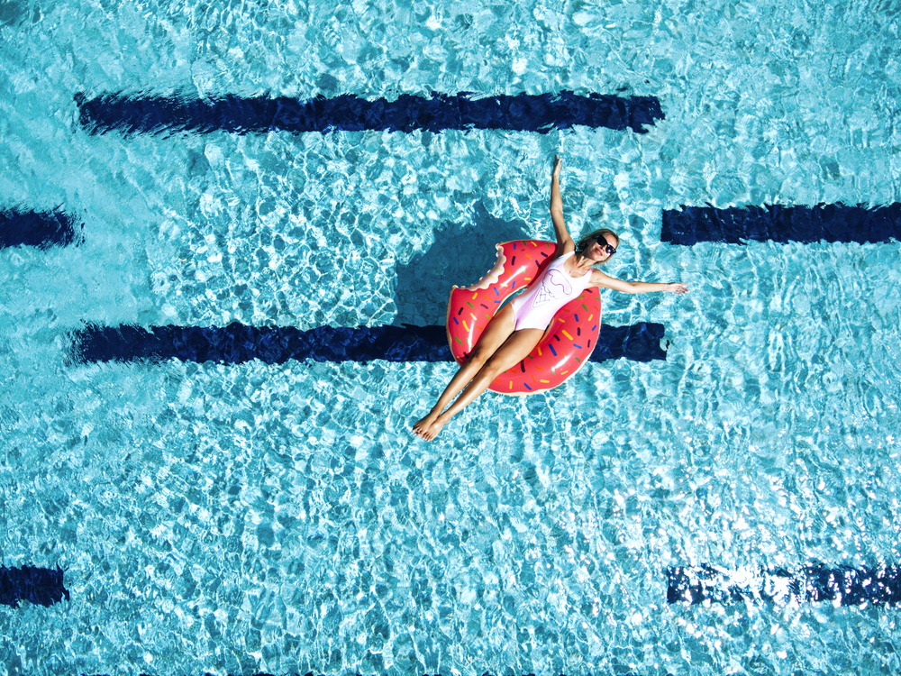 Woman floating on pool