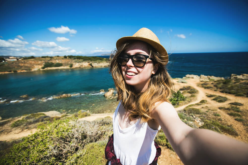 Woman at the top of mountain