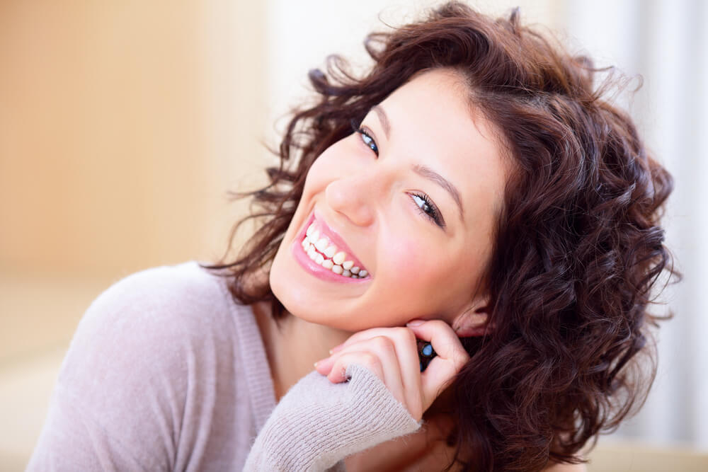 Smiling woman with curly hair