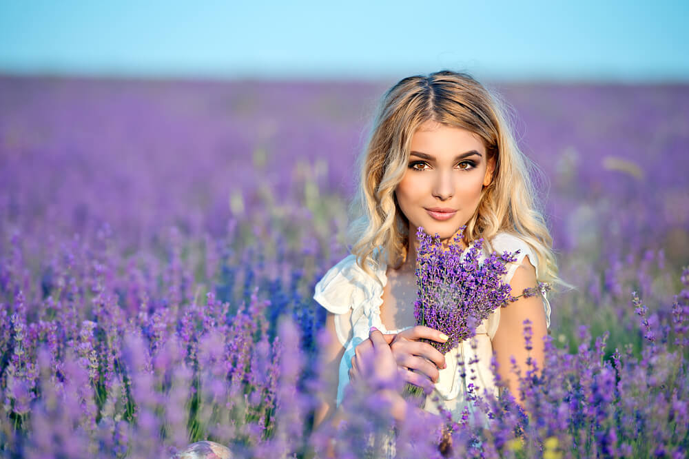 Smiling woman in a field of lavender