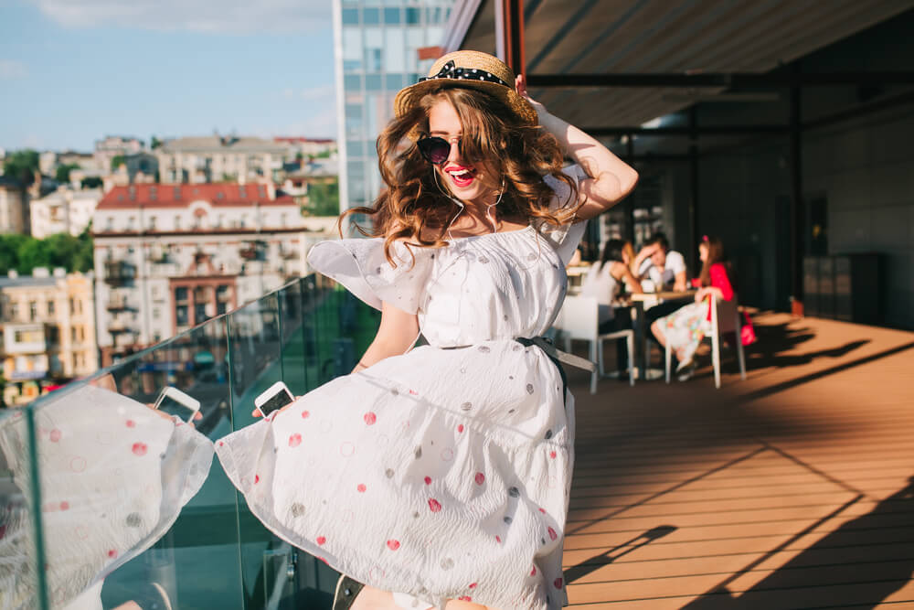 Woman in white summer dress outdoors