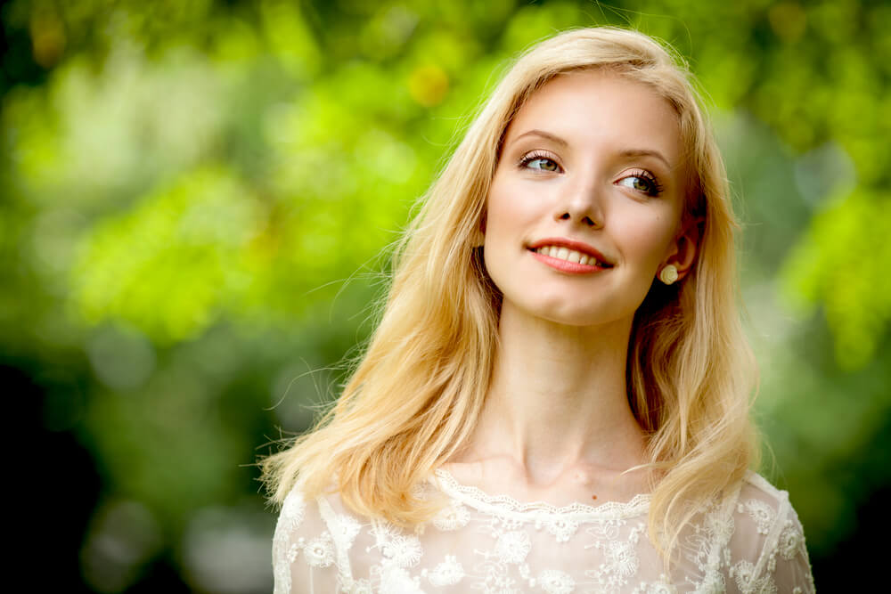 Woman smiling outdoors