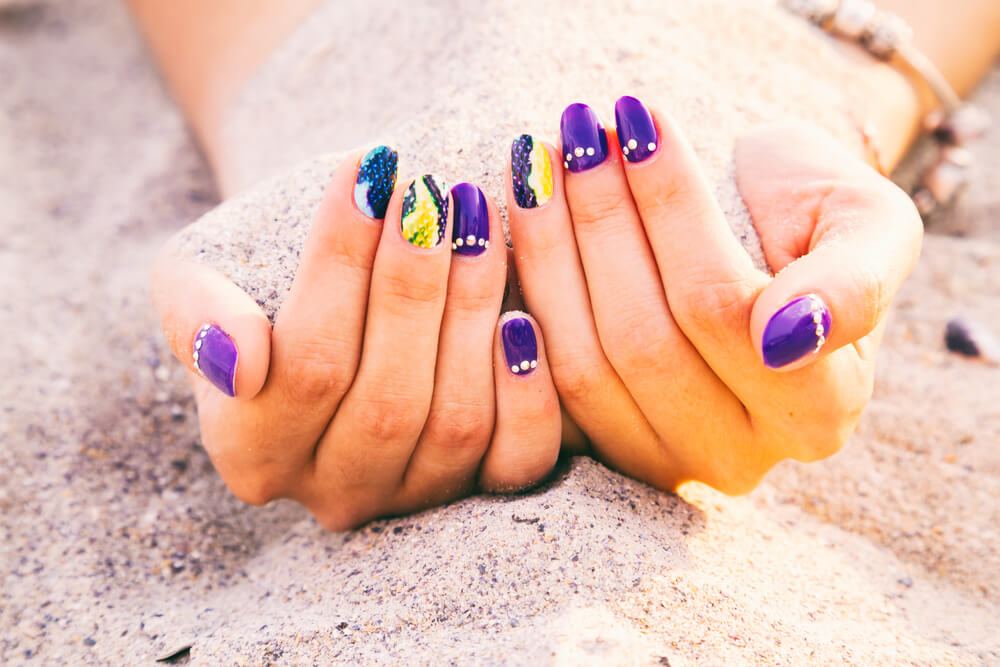 Purple and blue nail design with snakeskin effect