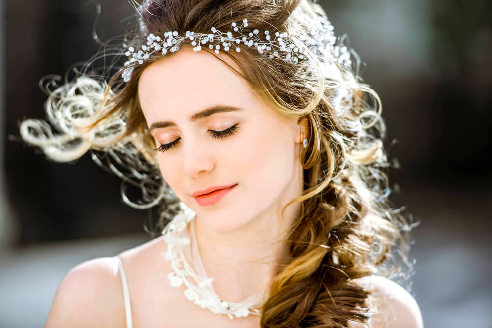 Young woman accessories in her curly braid