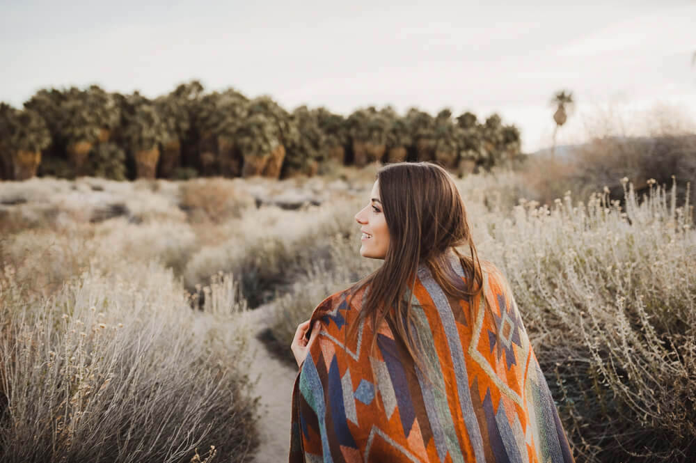 Woman walking through nature in cold winter weather