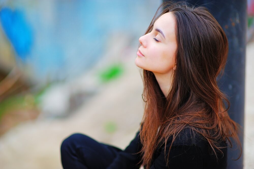 Young woman breathing and relaxing