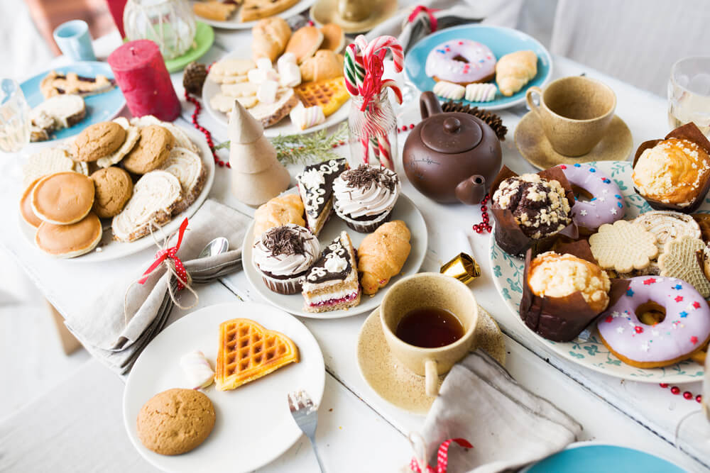 Selection of sweet baked goods, including muffins, donuts and waffles 