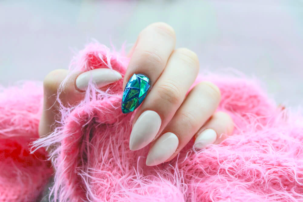 Pale nude nail art with rhinestone