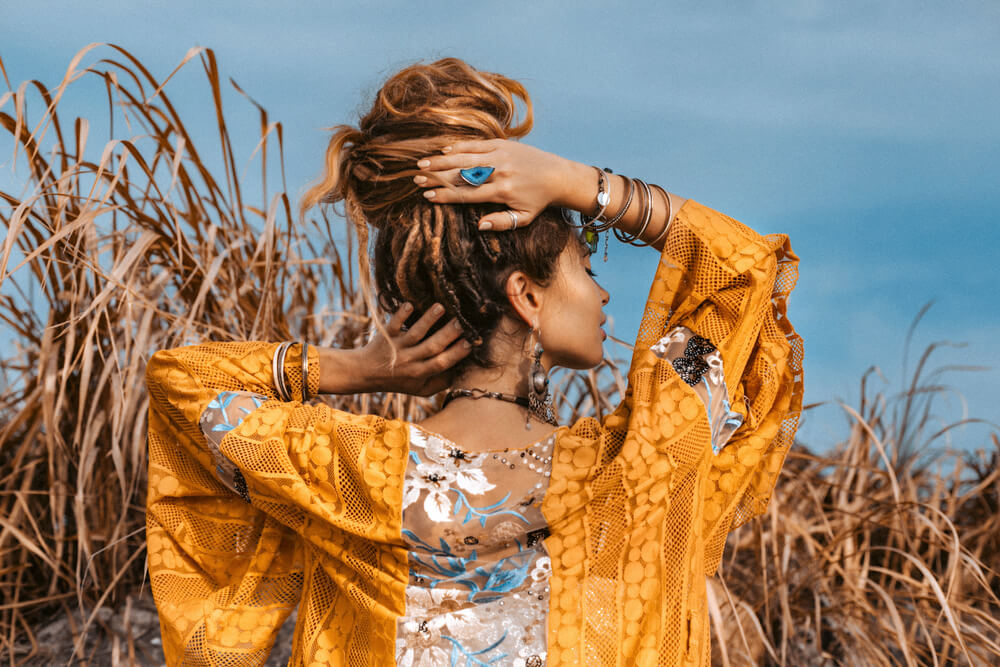 Fashionable woman in yellow flowy cardigan