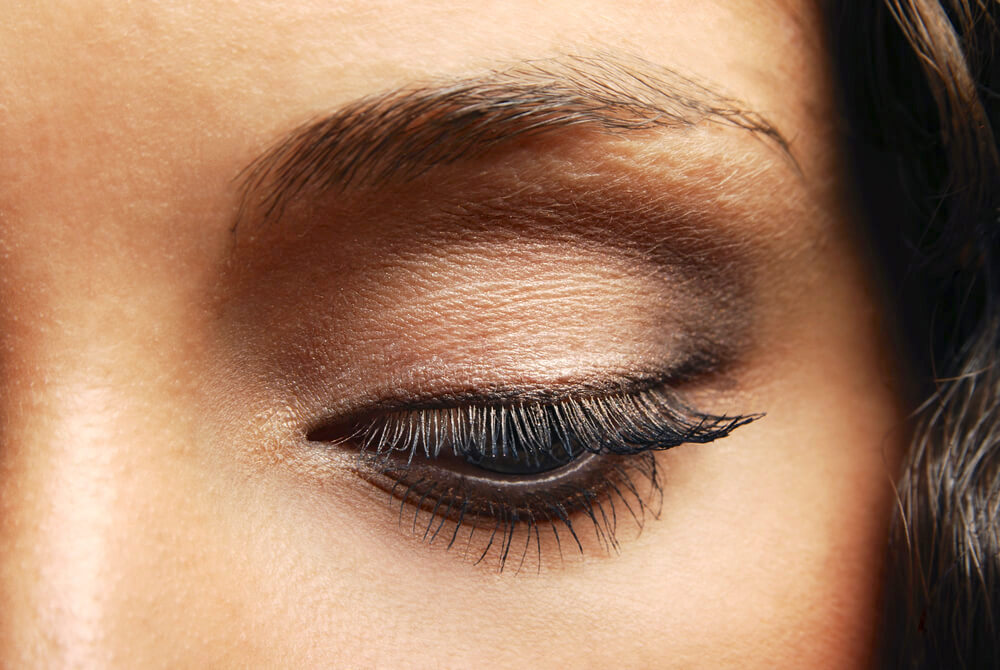 Closeup of eye with black eyeliner and soft brown eyeshadow