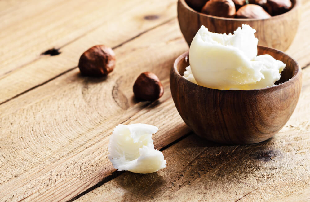 Shea nuts and butter in a bowl