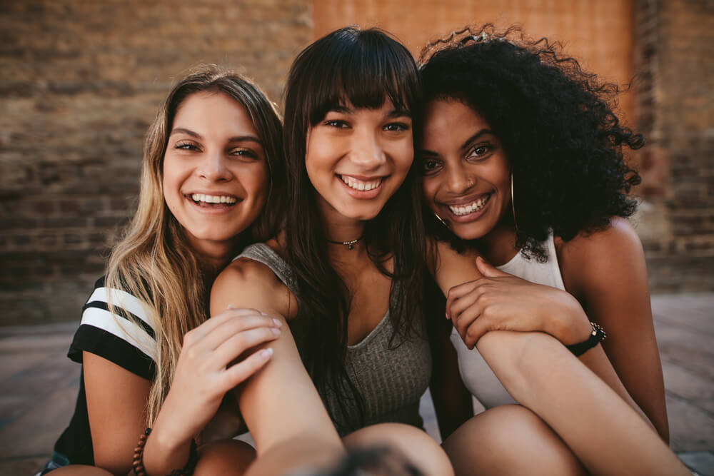 3 women, one with choppy bangs