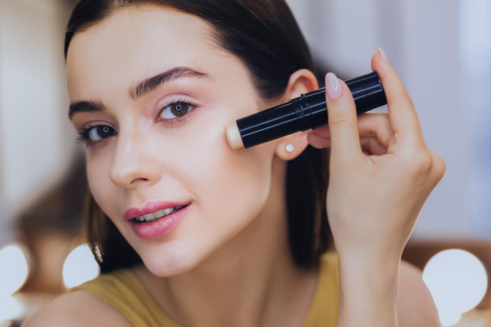 Woman applying foundation