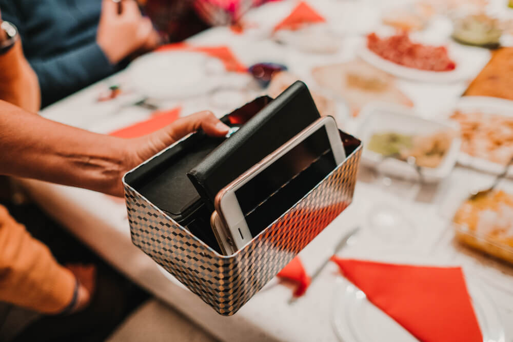 Phones in a box at restaurant