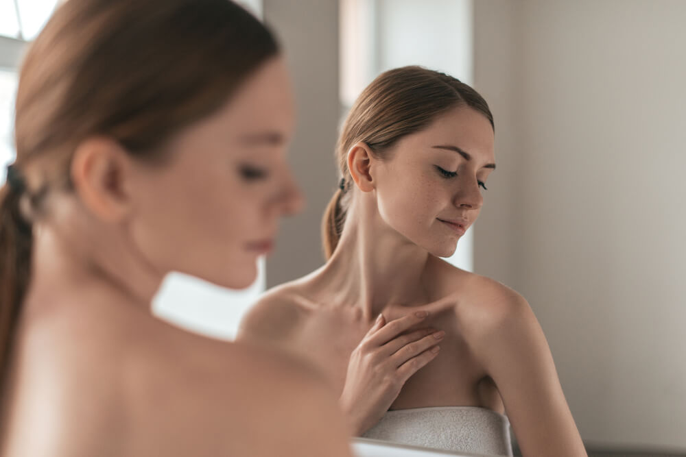 Woman looking at shoulder