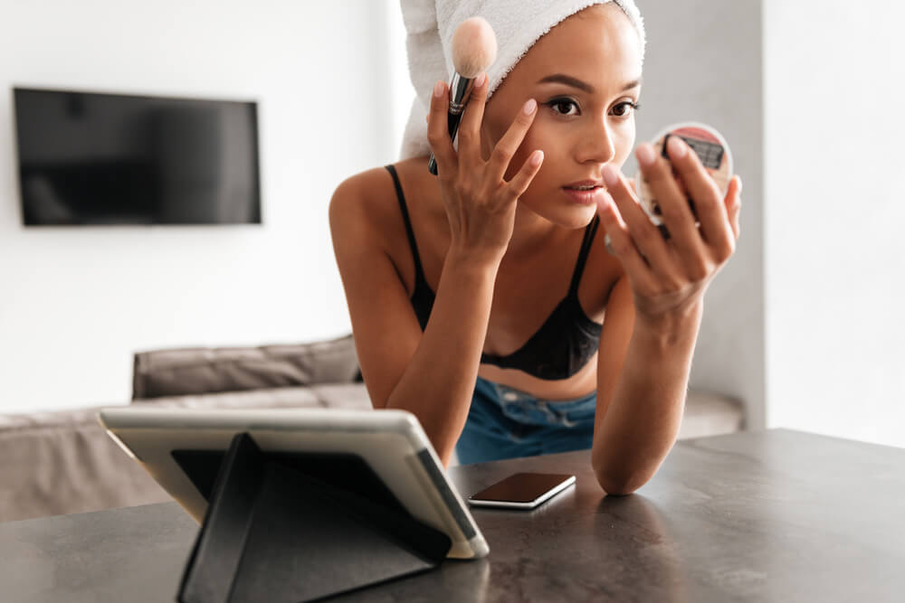 Woman applying makeup