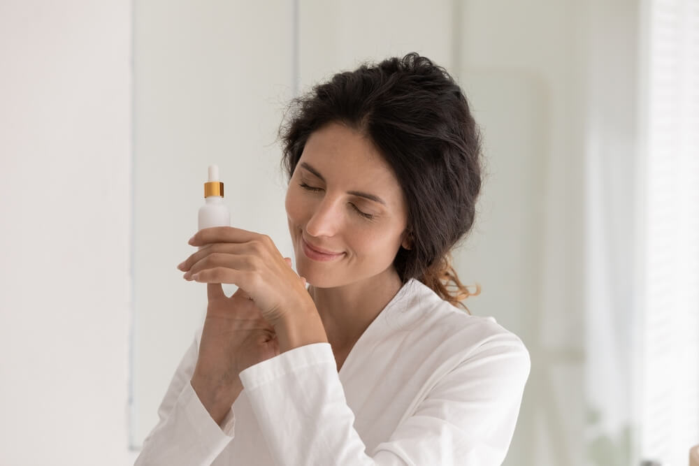 woman smelling hand