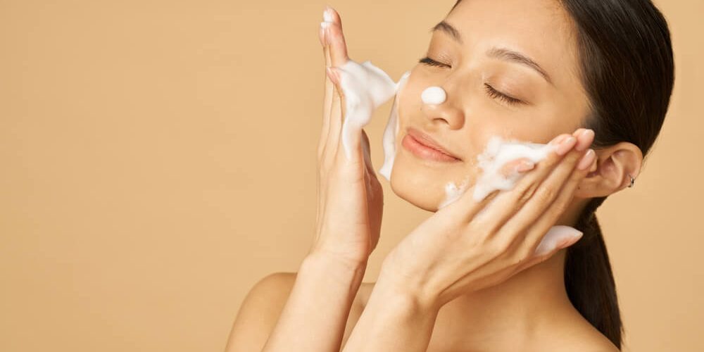 woman washing face