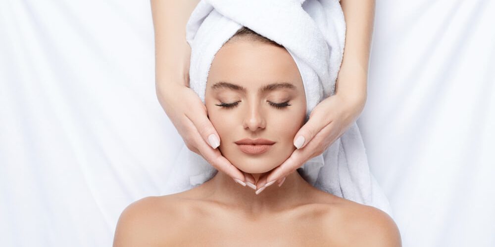 Woman having head massage in spa