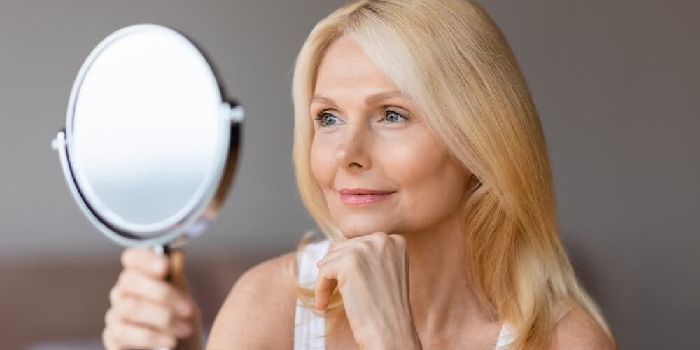 woman holding mirror